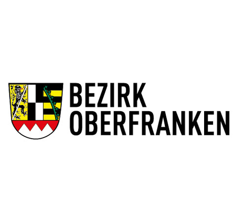 Logo mit Wappen und Text „Bezirk Oberfranken“ auf weißem Hintergrund.